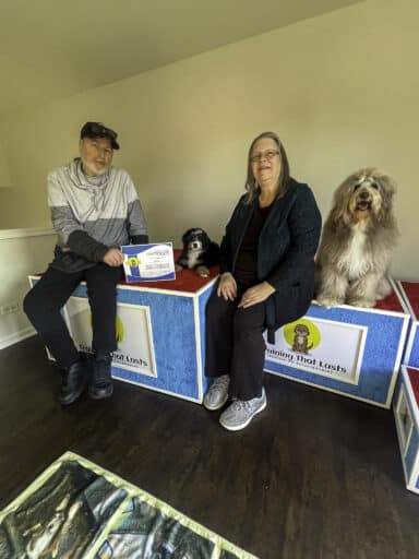 A Family picking up their Trained Bernedoodle Puppy from Training That Lasts which they bought from Hoosier Canines.